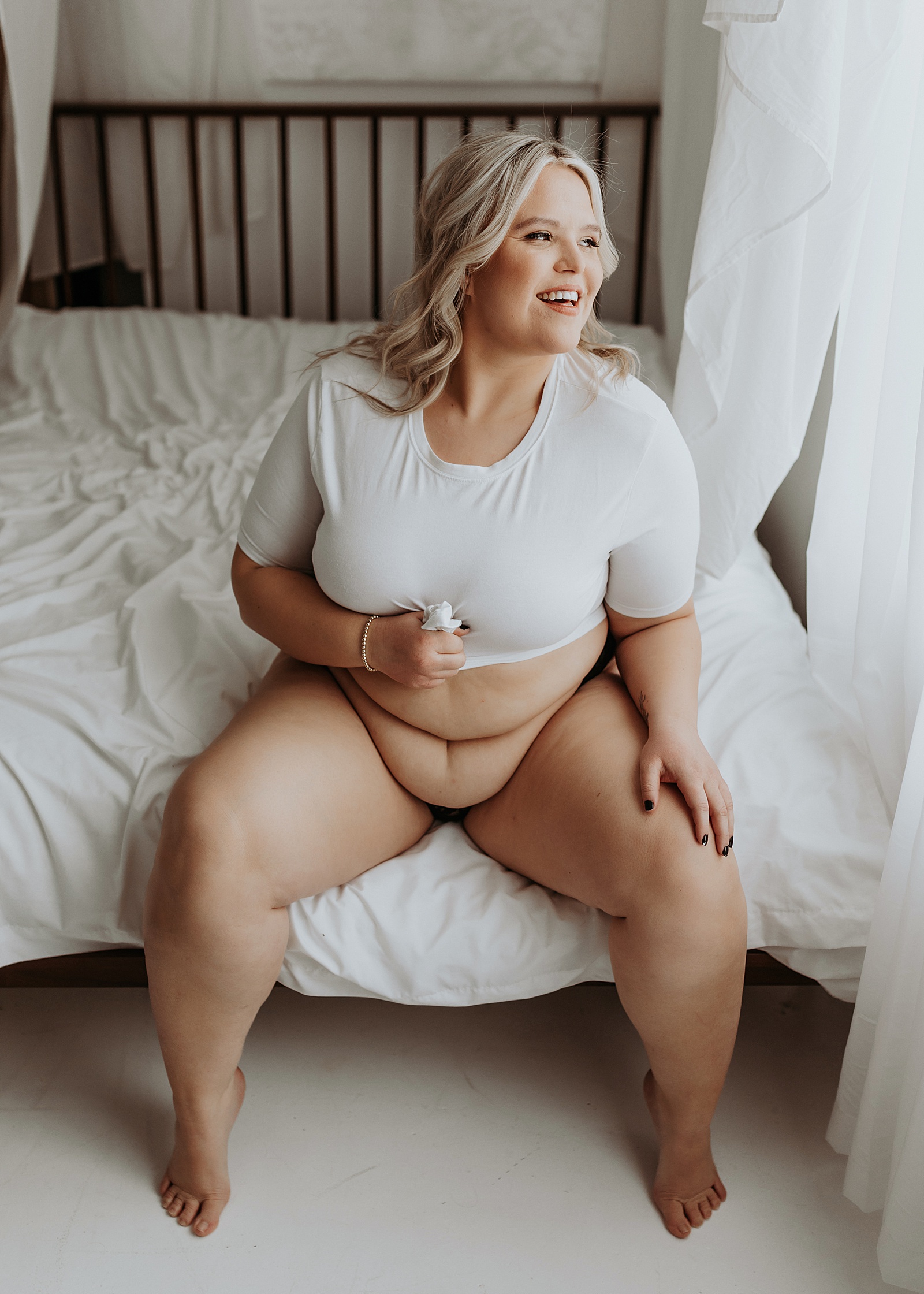 Woman in white tee and underwear at her empowering session 