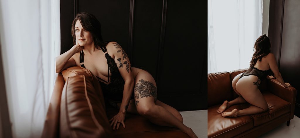 Woman with tattoos kneeling on a couch for sexy photo shoot