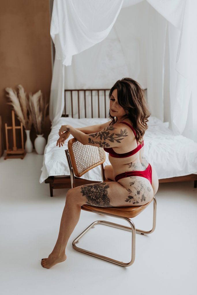 Woman in red lingerie sitting on a chair in Minneapolis studio 