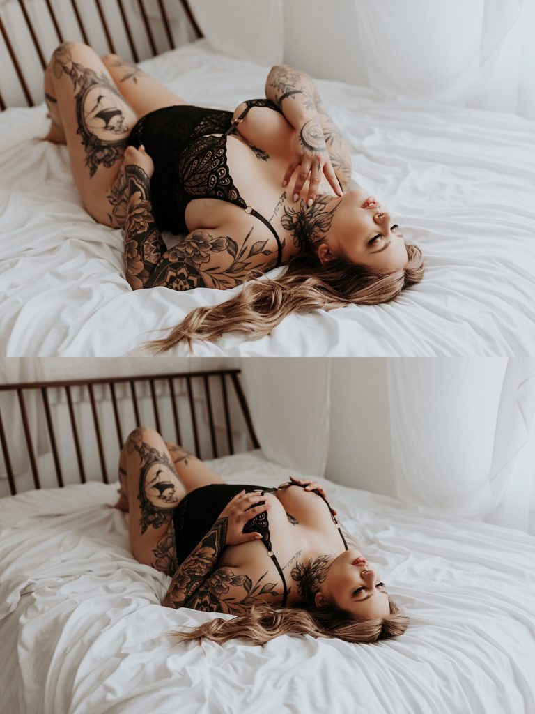 woman with tattoos wearing black on bed for Spicy Studio Shoot