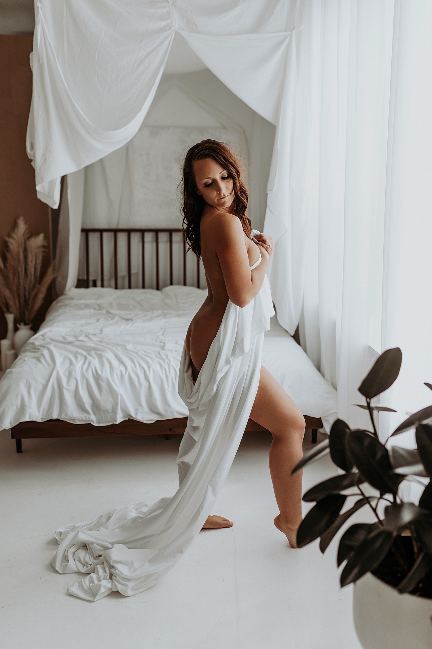 nude brunette covered with white sheet by Mary Castillo Photography