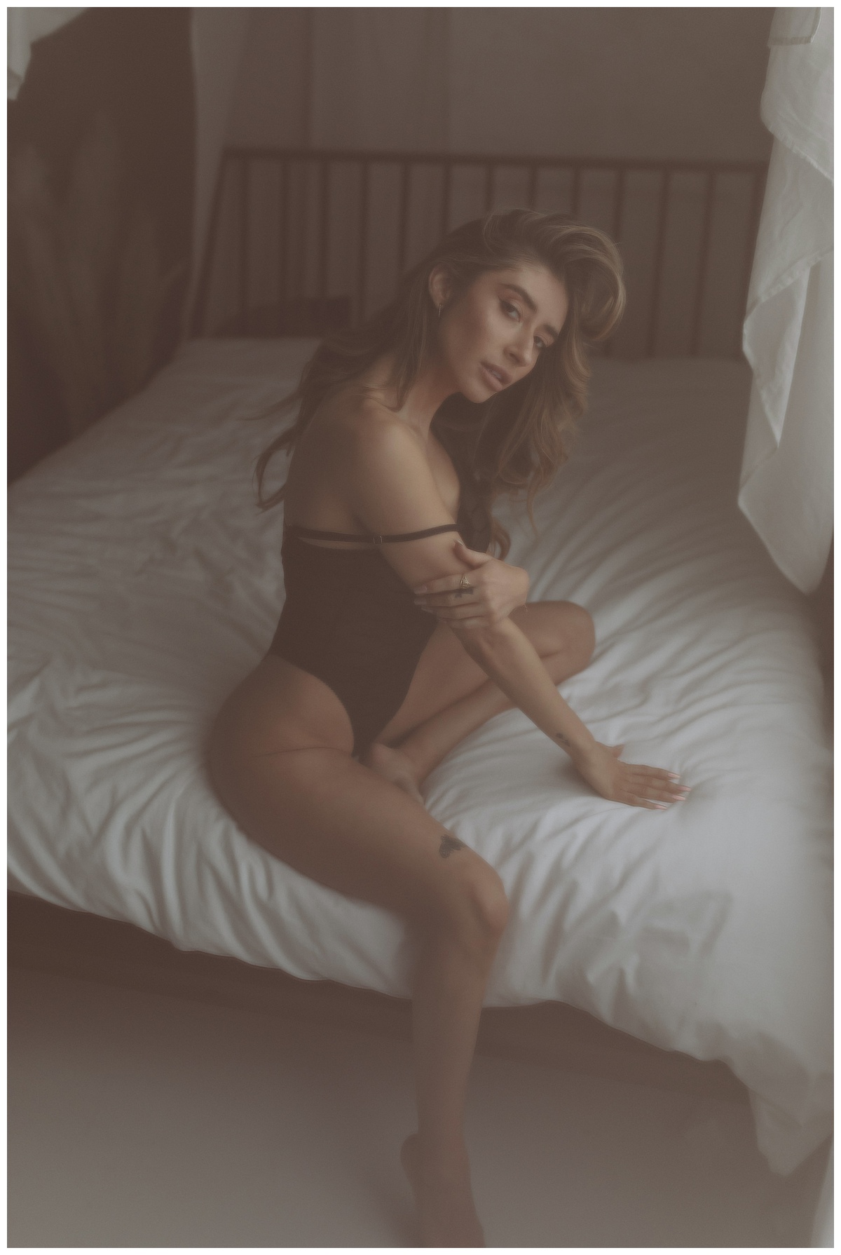 Adult sits on bed in black lingerie Mary Castillo Photography