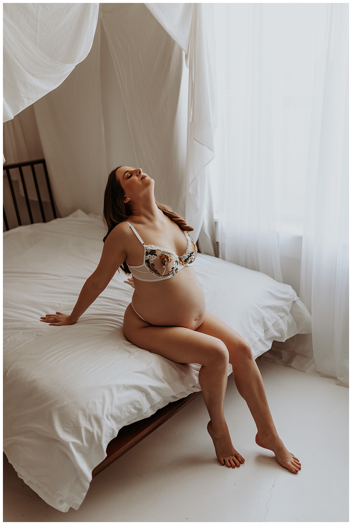 Mother leans back on bed for Minneapolis Boudoir Photographer