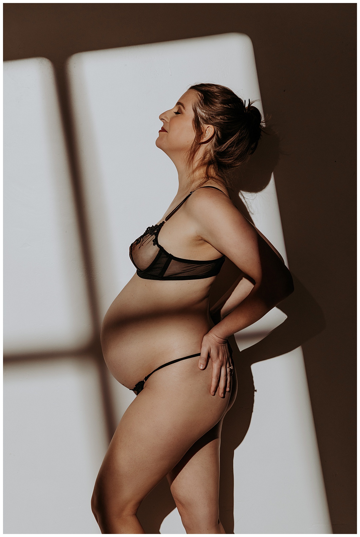 Mama grabs body and embraces pregnancy for Maternity Boudoir session