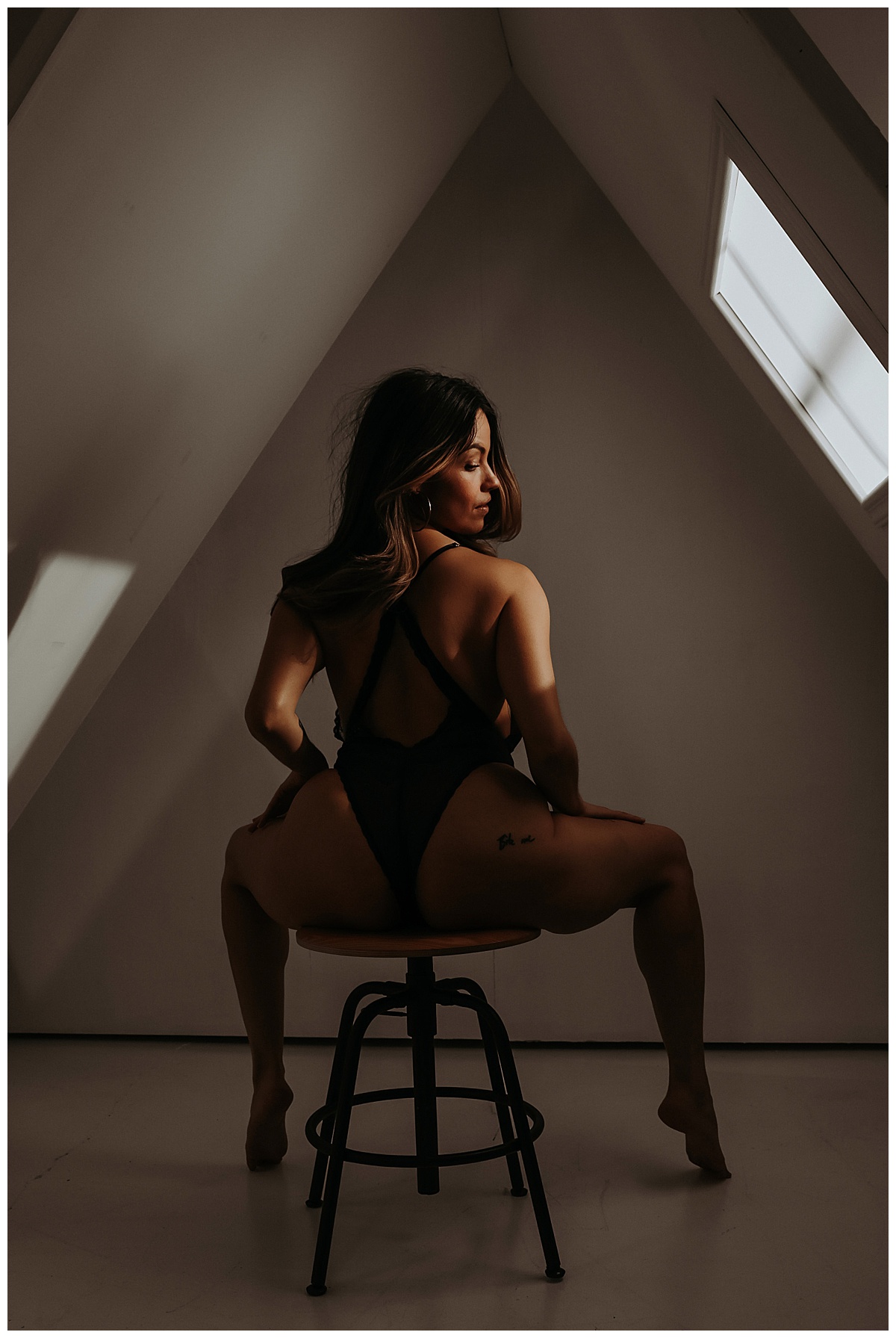 Woman sits on stool for Mary Castillo Photography