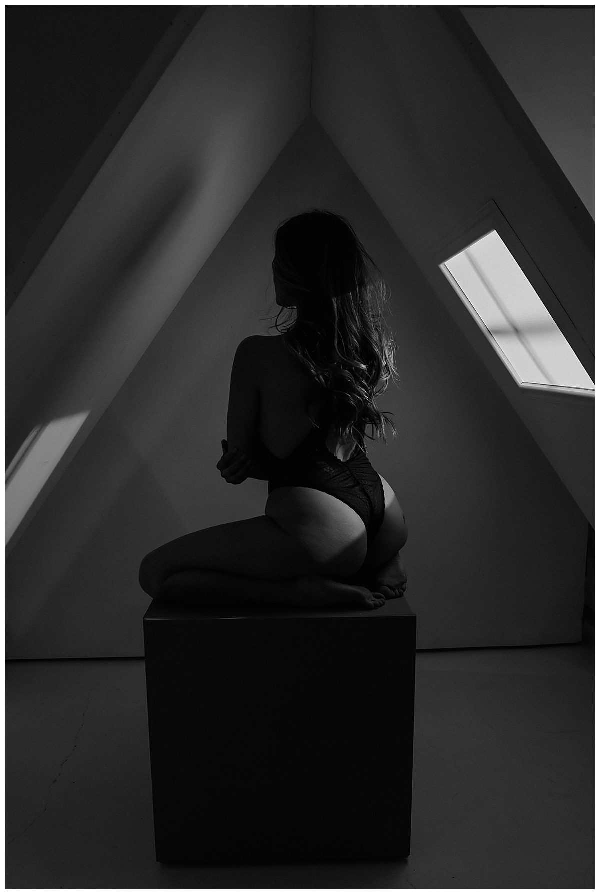 Person holds body on box for Sultry Skylight Session
