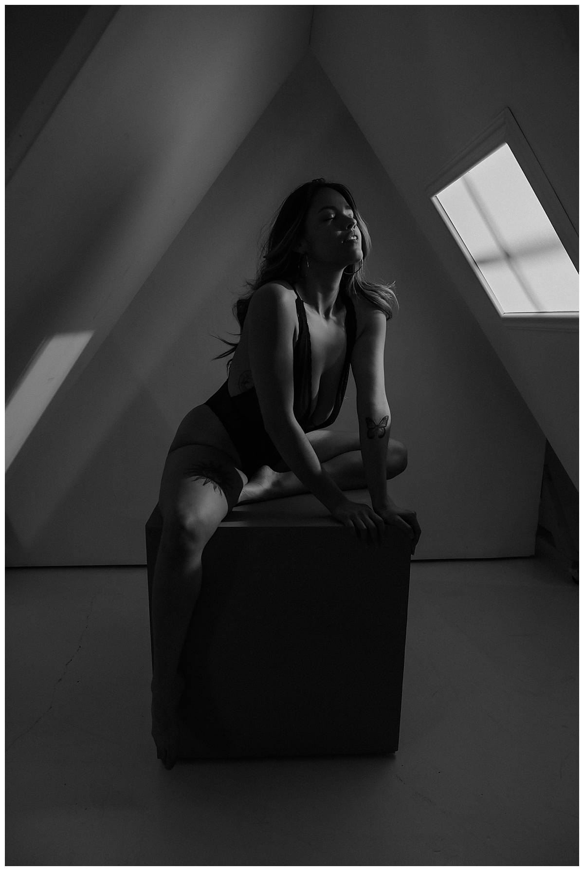 Female leans onto box for Minneapolis Boudoir Photographer