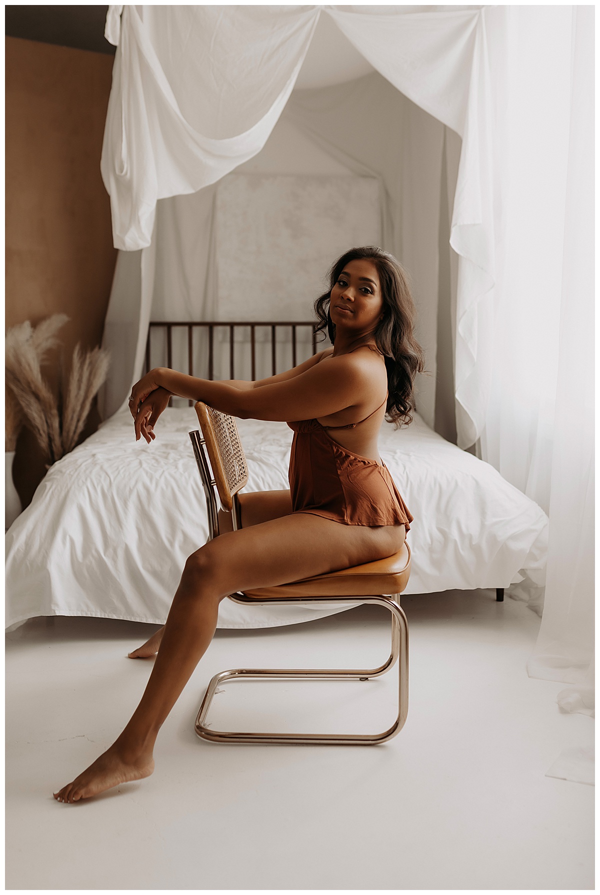Person sits on edge of chair for Minneapolis Boudoir Photographer