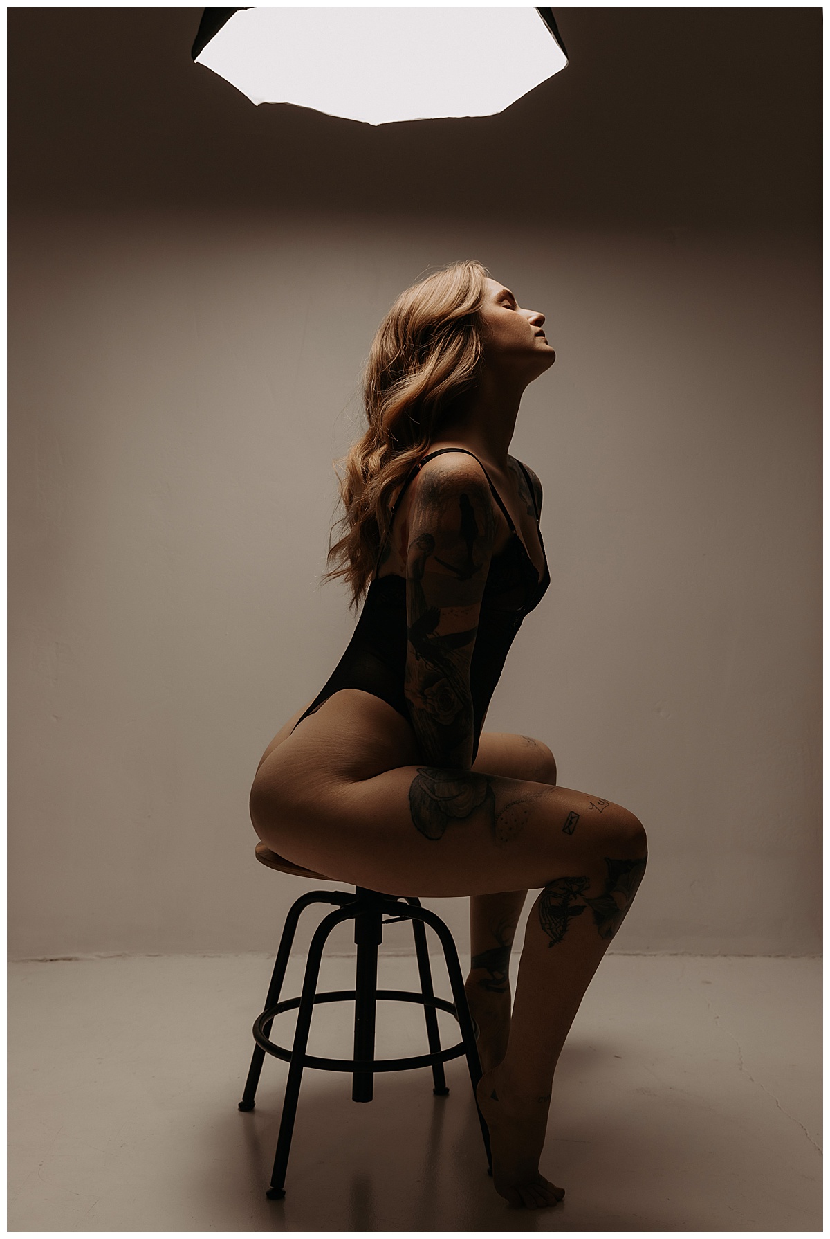 Person sits on the chair for Minneapolis Boudoir Photographer