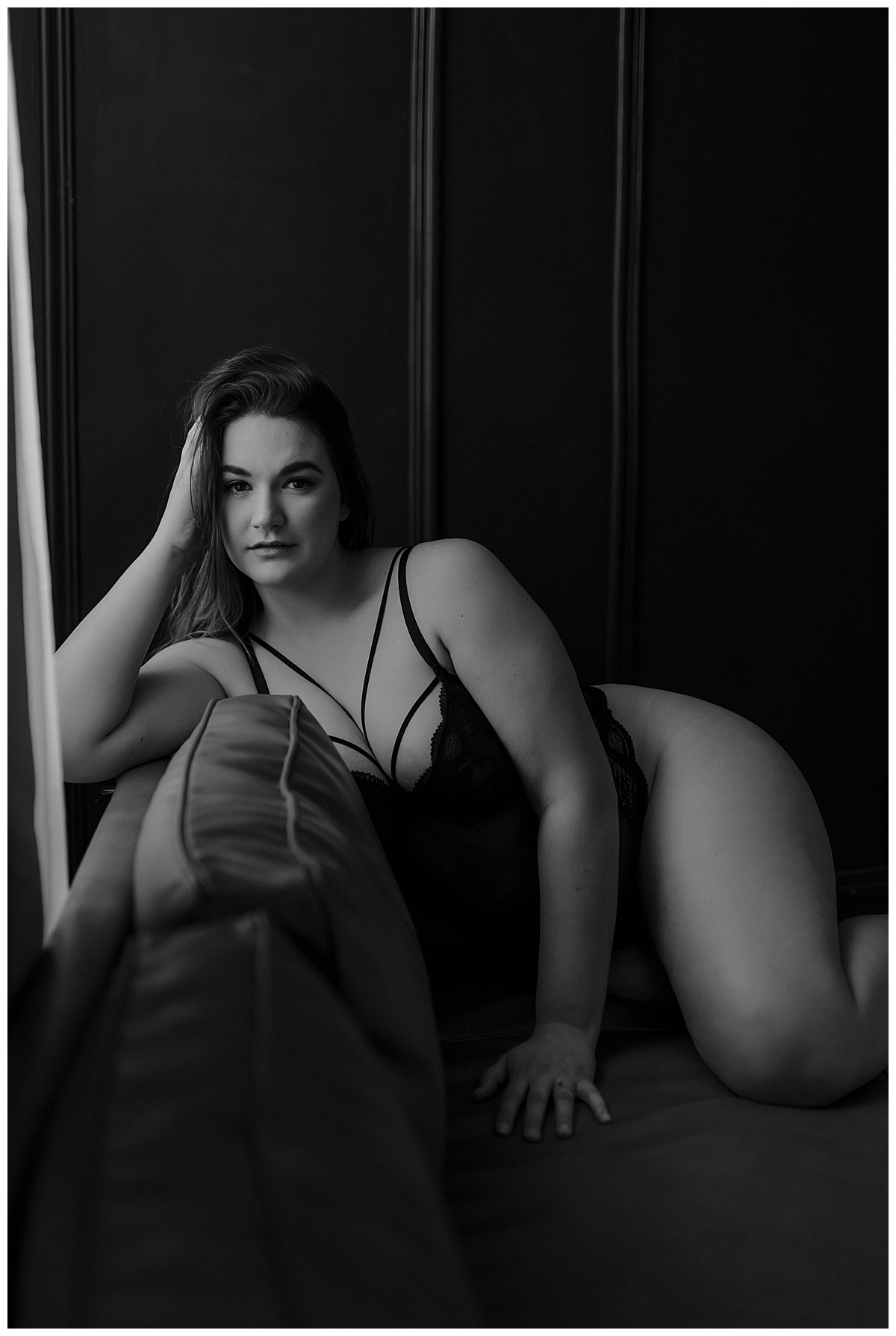 Person leans on the back of the couch for Minneapolis Boudoir Photographer