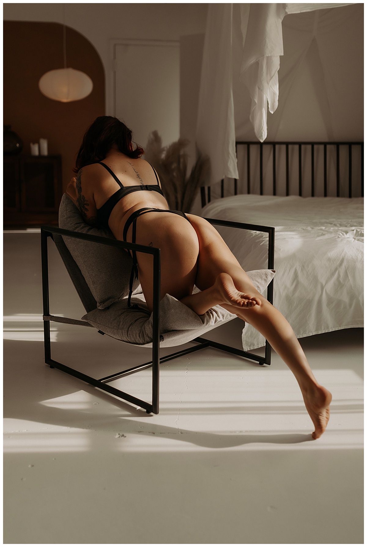 Person sits on the chair for Minneapolis Boudoir Photographer