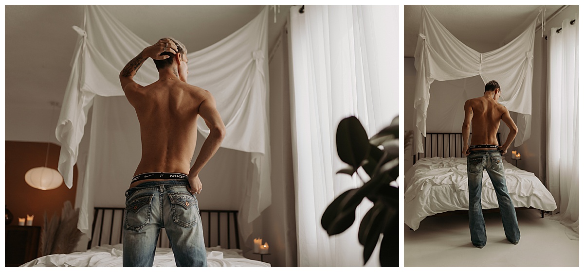 Guy stands in front of a bed for Minneapolis Boudoir Photographer