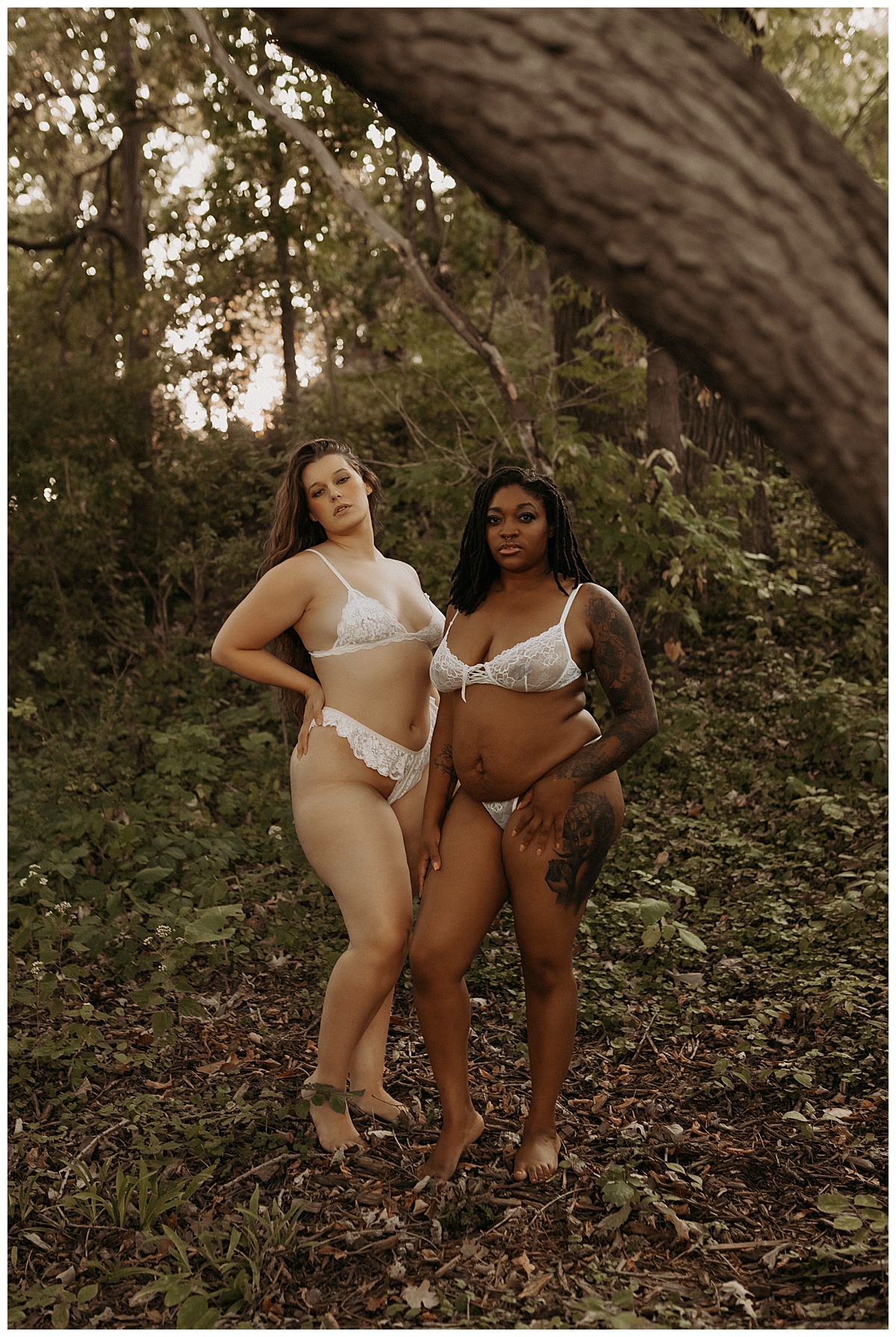 Two women stand together in white lingerie for Minneapolis Boudoir Photographer