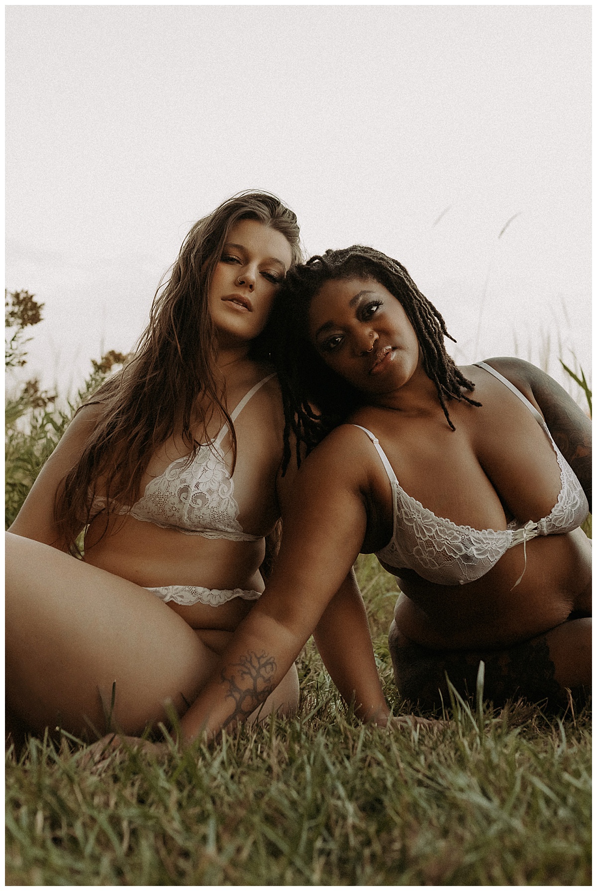 Woman sit together in white lingerie for Mary Castillo Photography