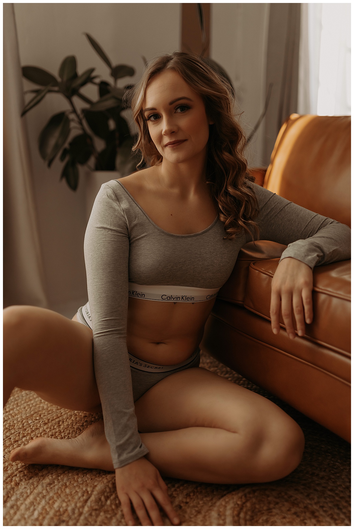 Woman rests arm on a couch wearing Long-Sleeve Lingerie