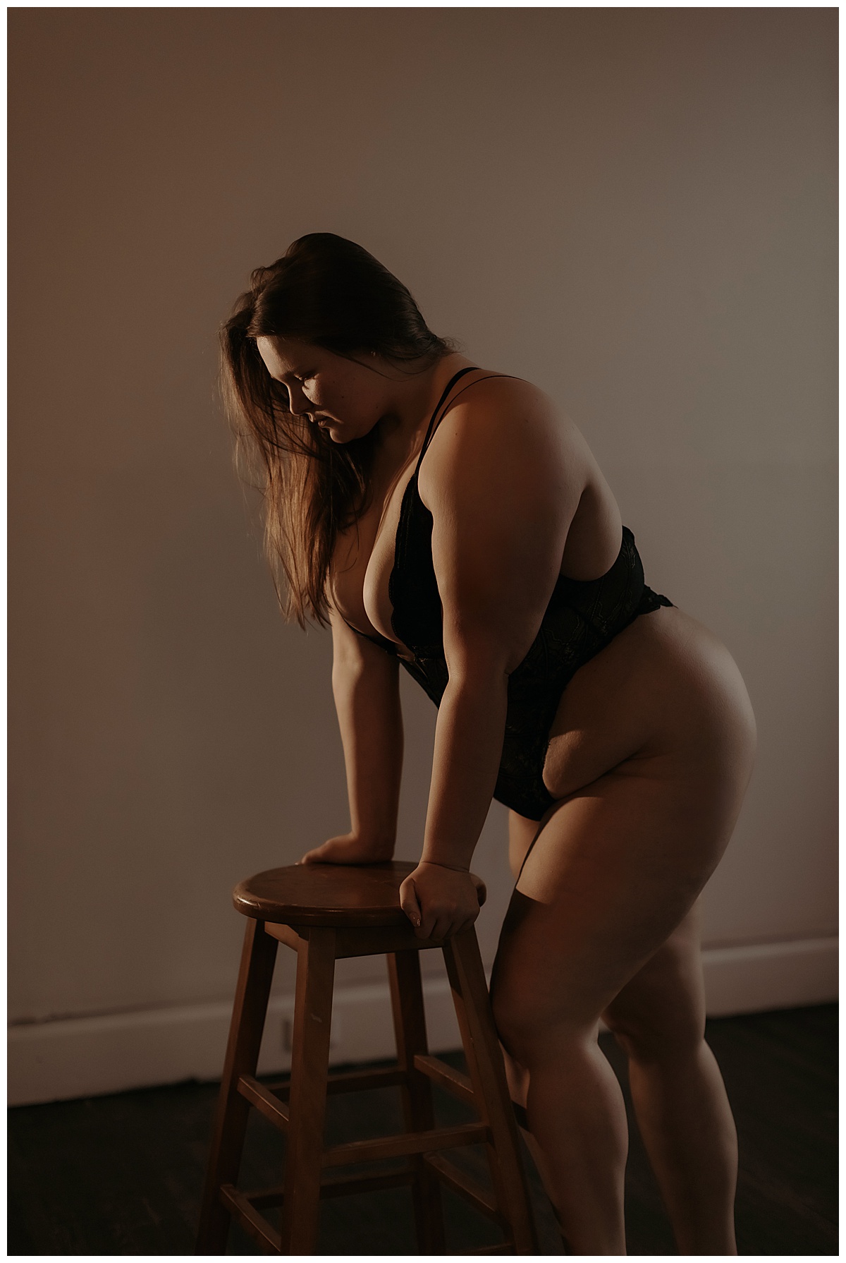 Girl leans onto a stool wearing one of the recommended Lingerie Styles 