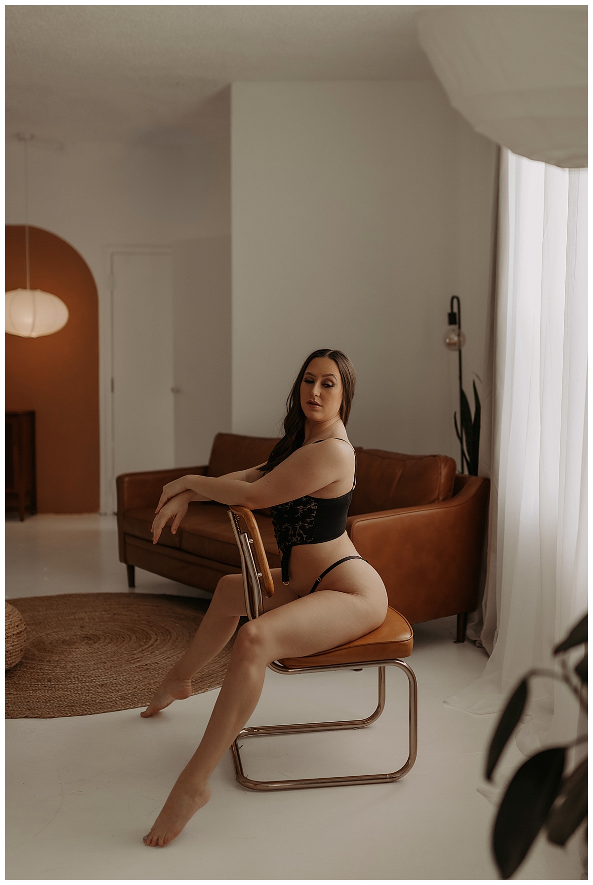 Woman sits on a chair for Mary Castillo Photography