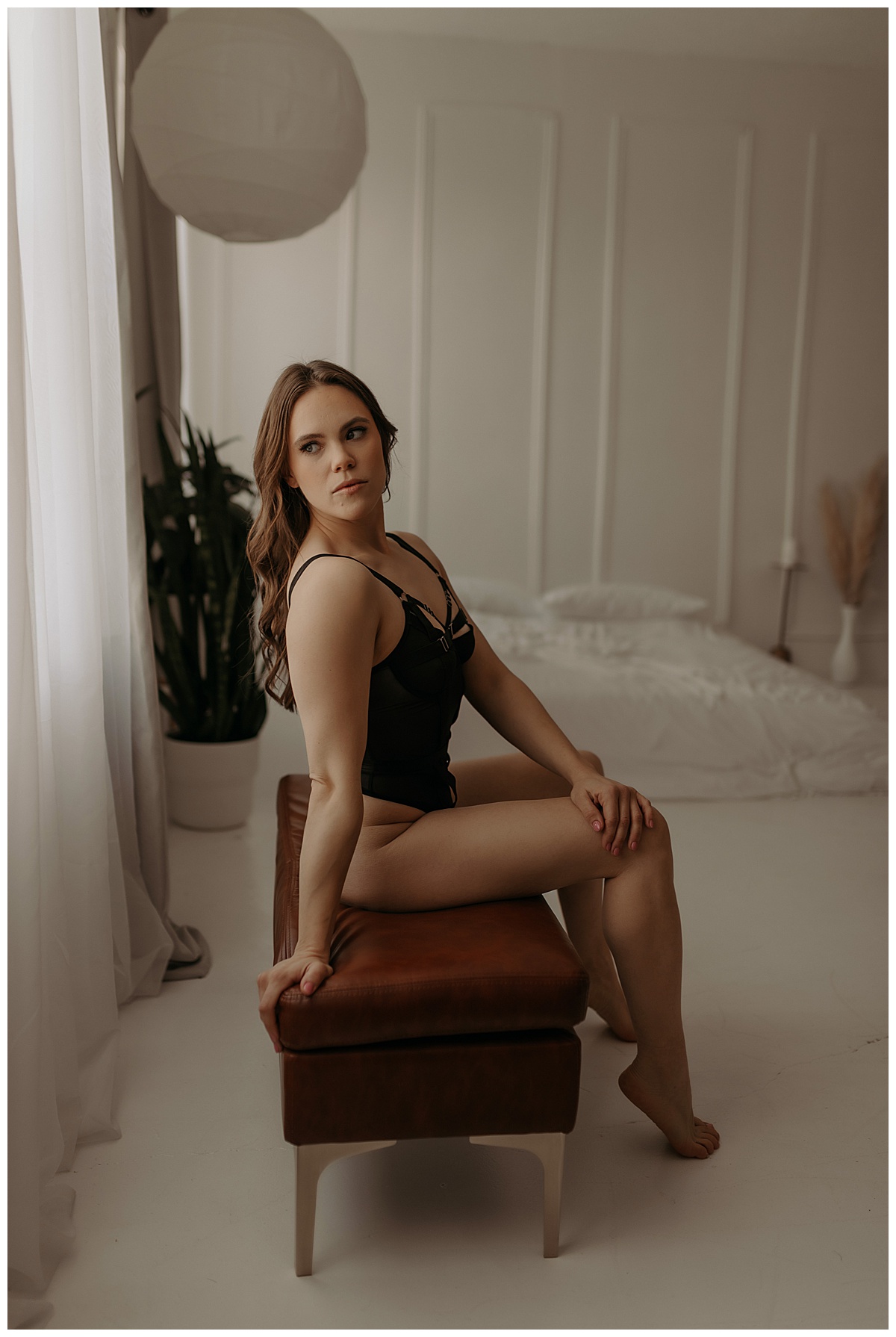 Girl wears black lingerie and sits on the stool after Choosing The Right Boudoir Photographer