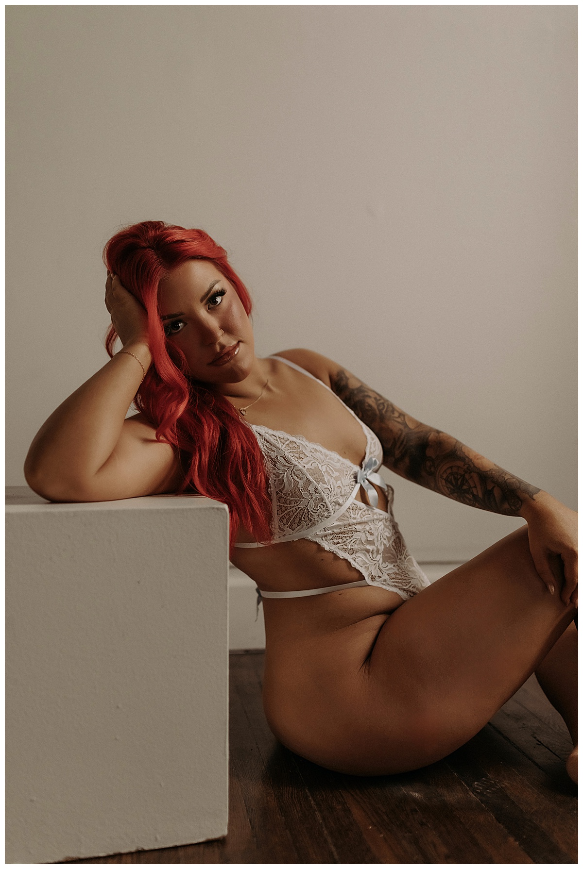 Adult sits on the floor wearing lingerie for Mary Castillo Photography
