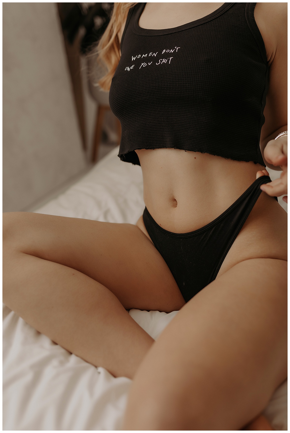 Person wears black cutoff shirt and black bottoms during her Birthday Boudoir Session