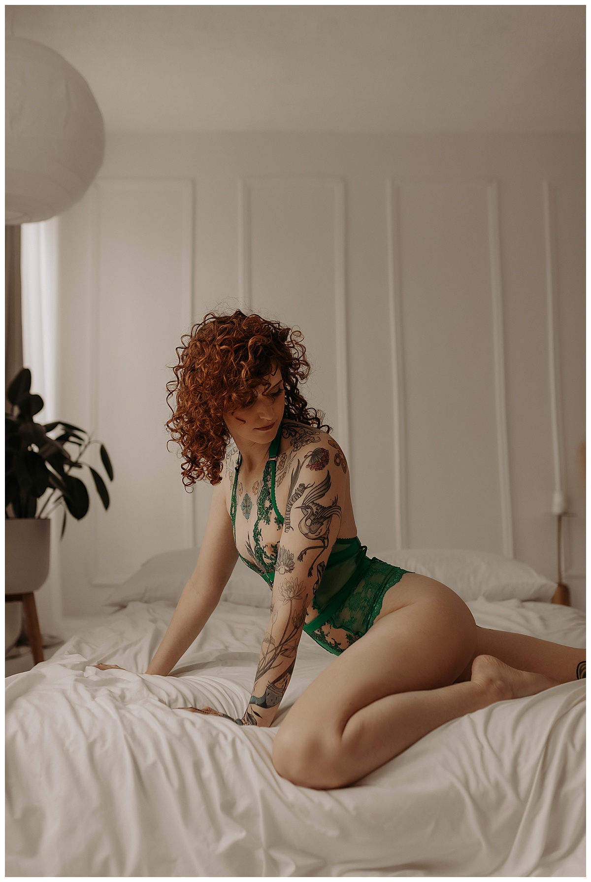 Girl wears green lingerie showing off one of the recommended Hairstyles For Boudoir Sessions
