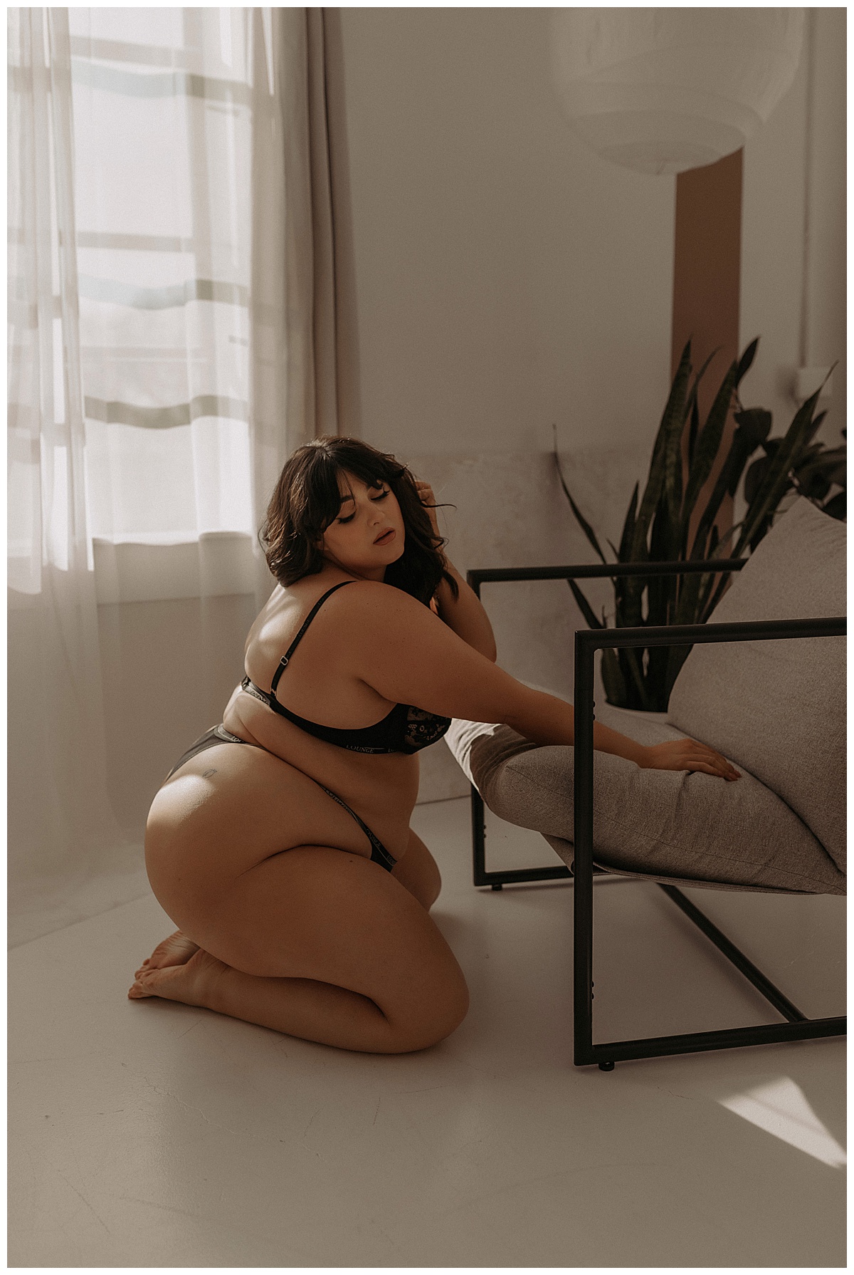 Adult kneels down onto a chair for Mary Castillo Photography