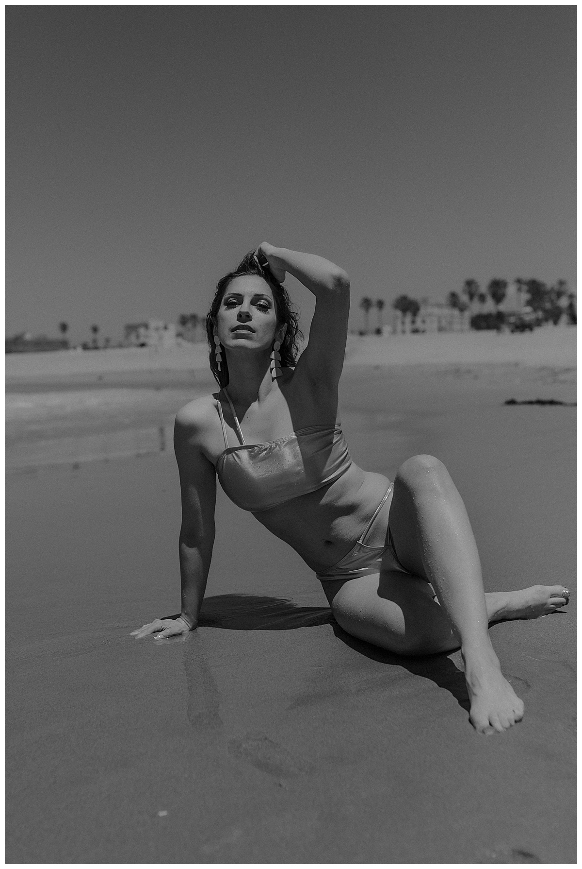 Female sits on the beach for Mary Castillo Photography