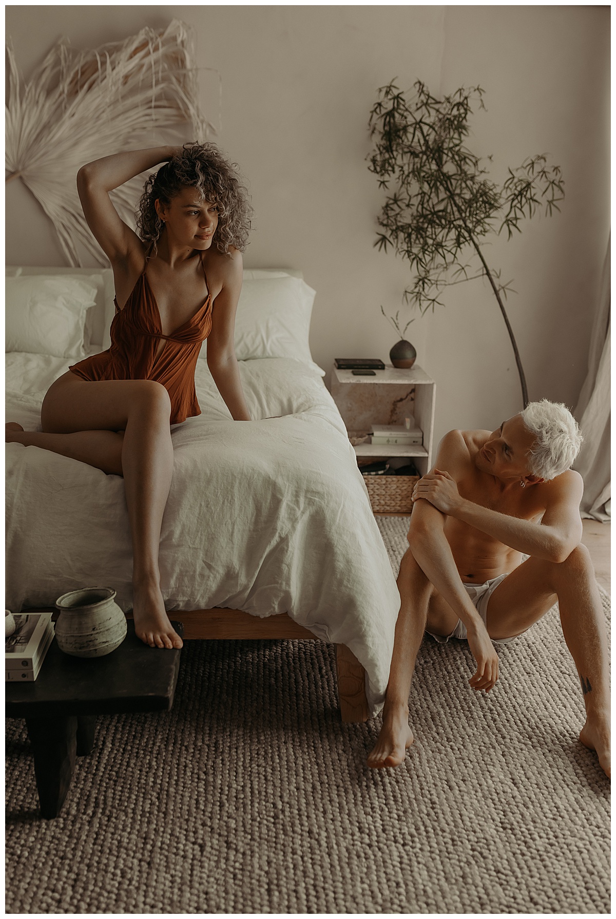 Two people stare at each other during a Couples Boudoir Session 