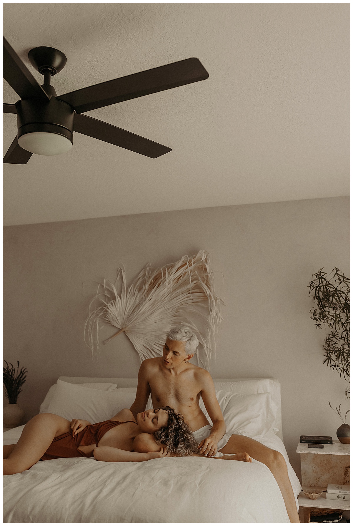 Couple sit on the bed together for Mary Castillo Photography