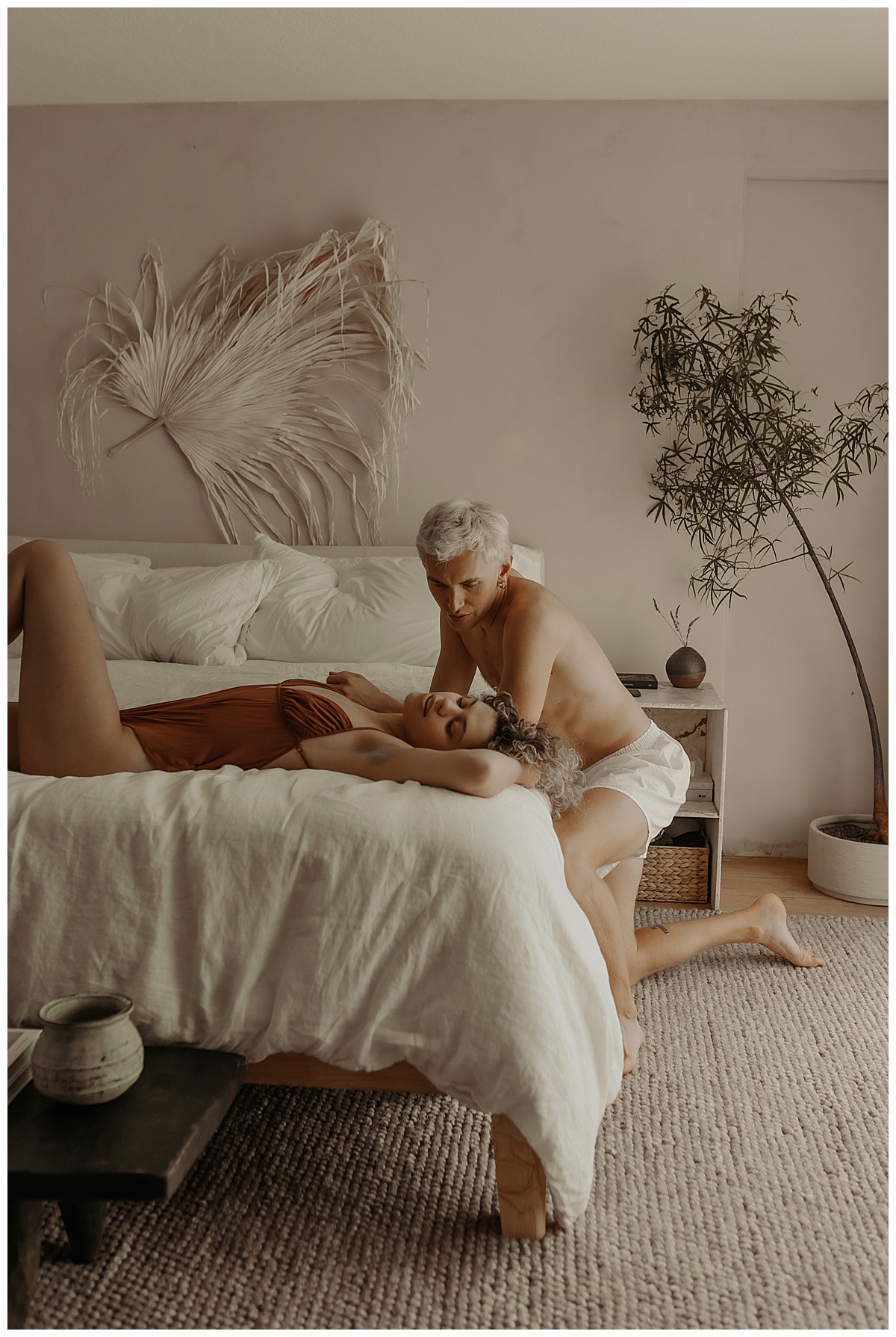 Couple lay together on the bed for Minneapolis Boudoir Photographer
