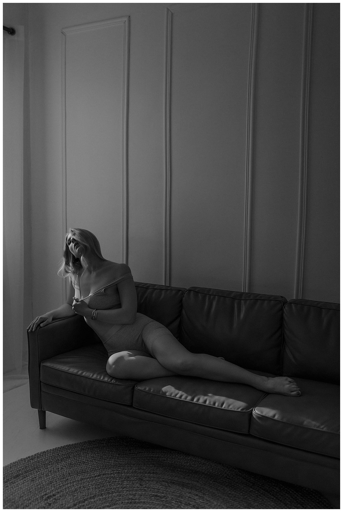 Person sits on the couch for Minneapolis Boudoir Photographer