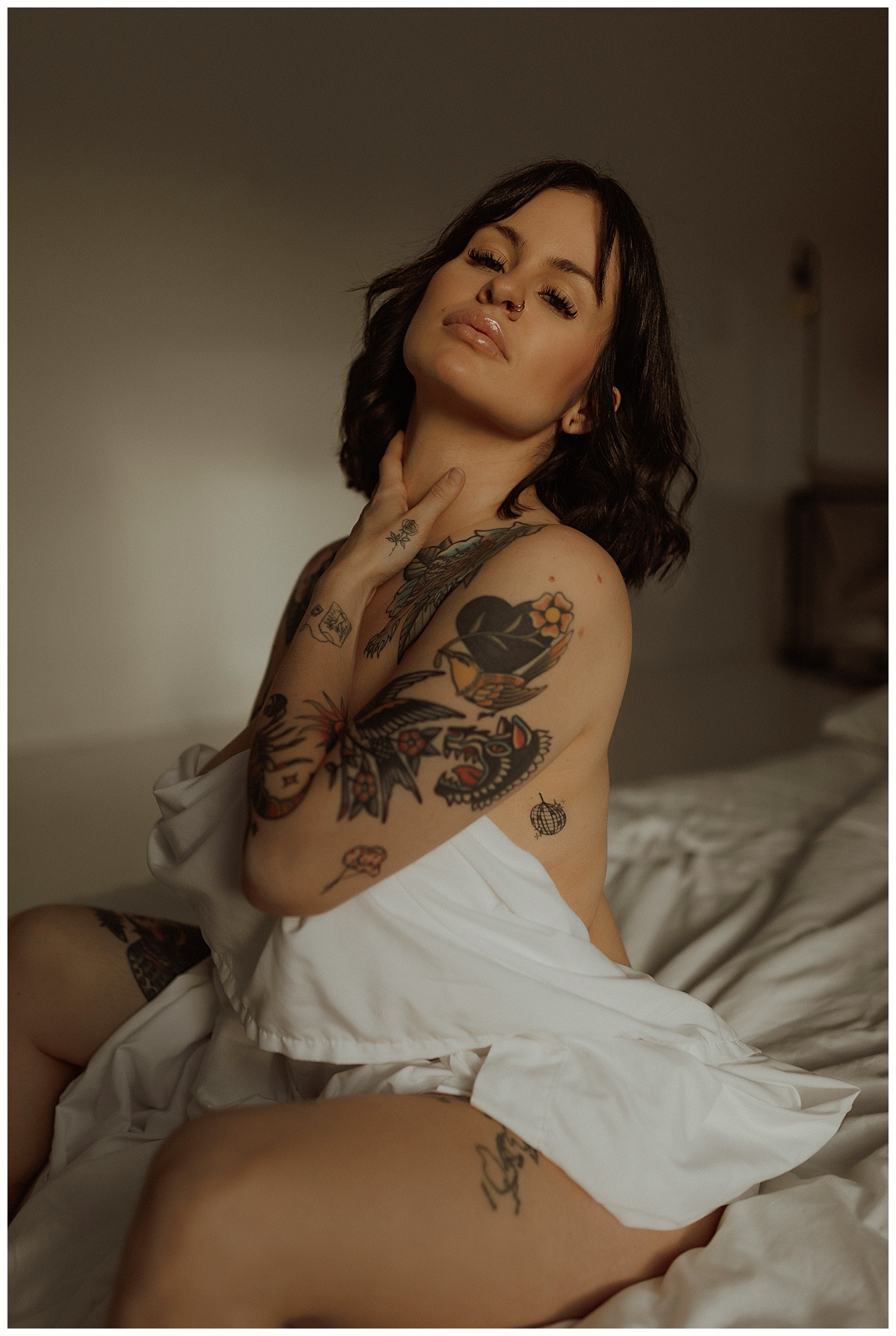 Adult covers her body with a white sheet for Mary Castillo Photography