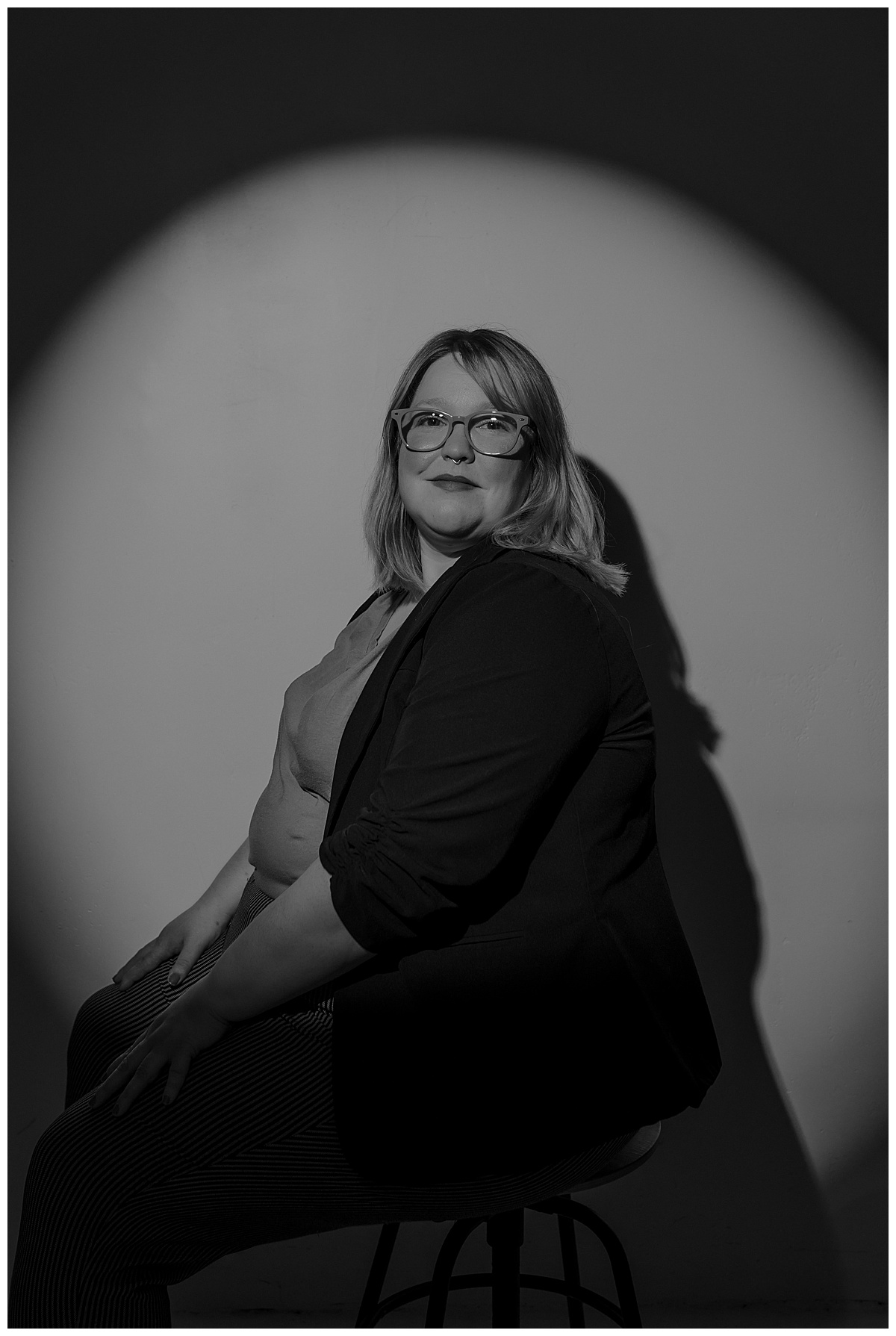 Woman sits on the stool for Mary Castillo Photography
