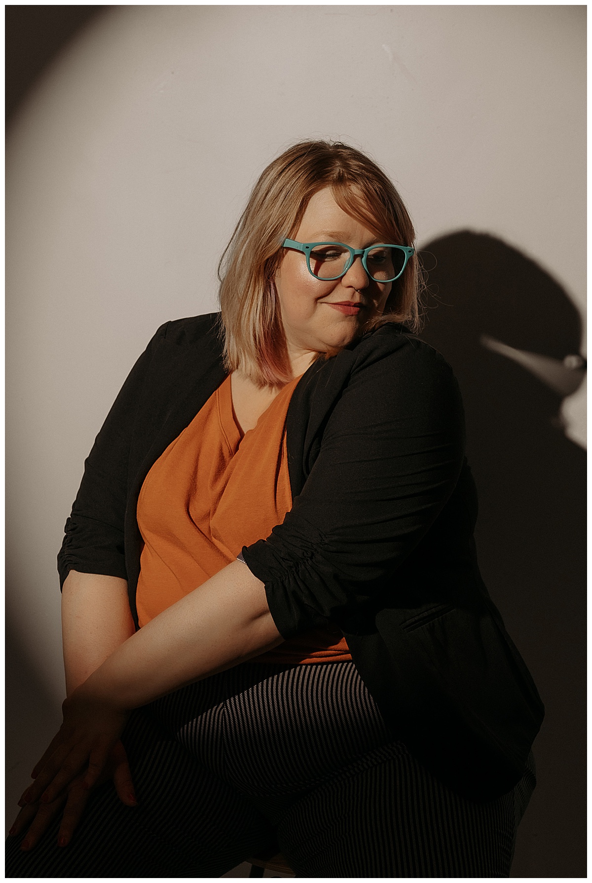 Adult looks over her shoulder for headshots by Mary Castillo Photography
