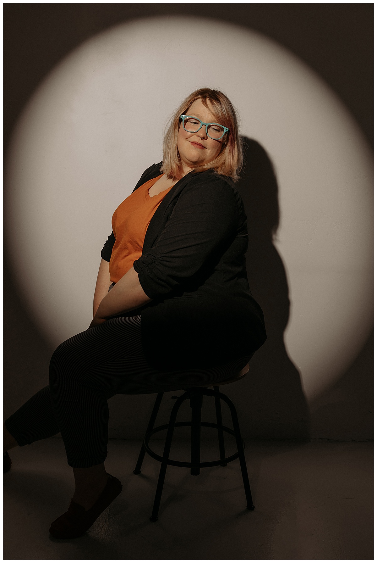 Person sits on the stool for Minneapolis Boudoir Photographer