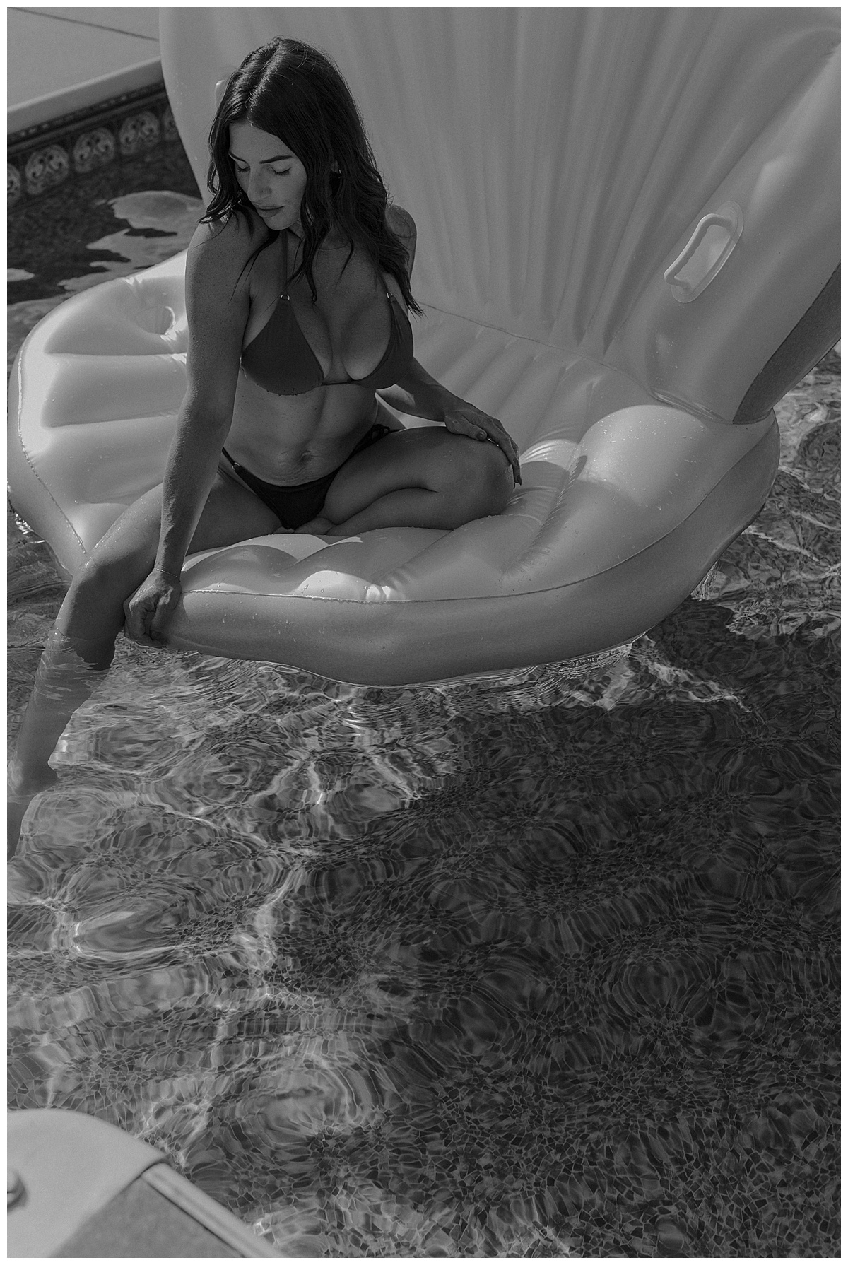 Adult sits on pool float by Mary Castillo Photography