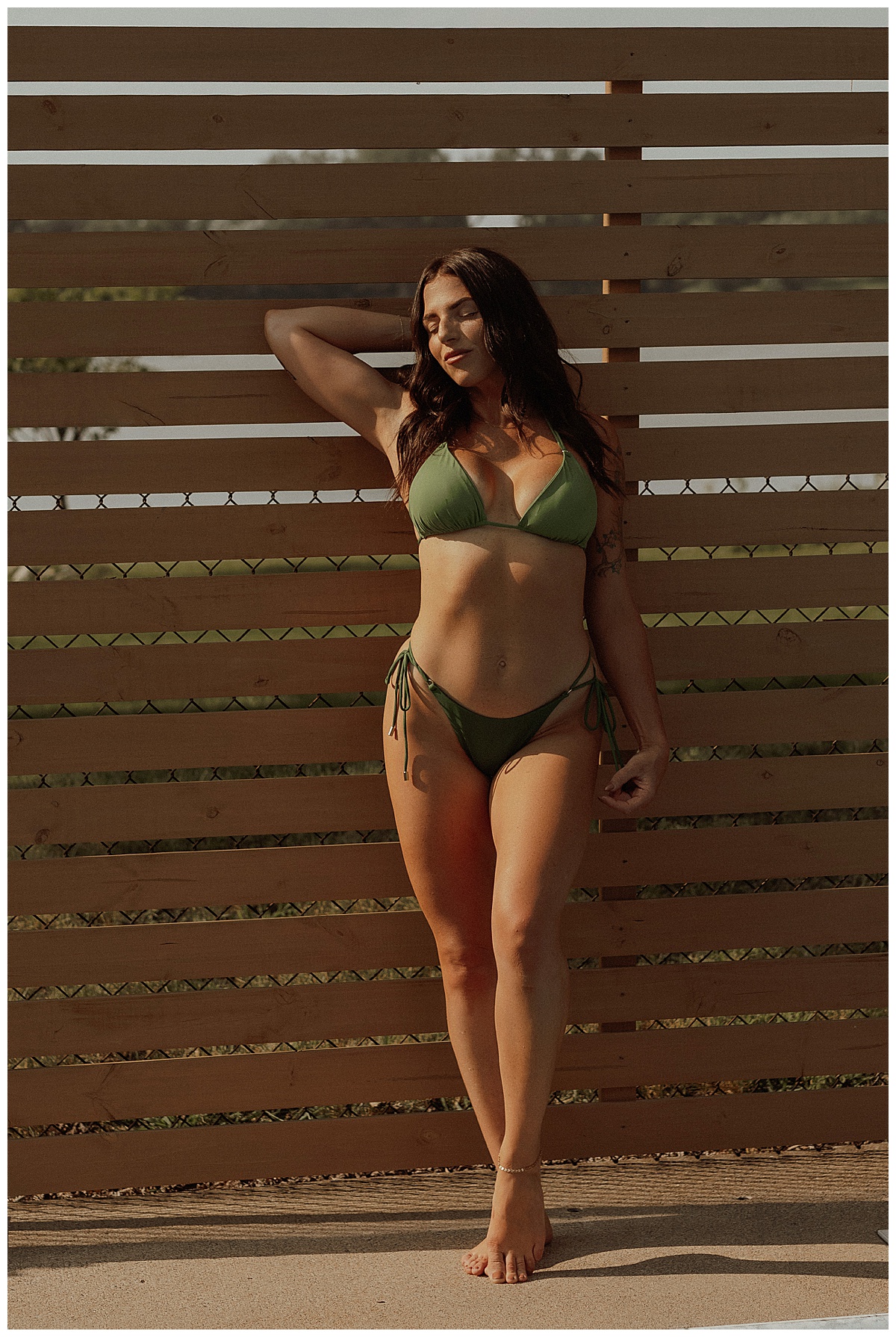 Adult wear stunning green bathing suit showing Why You Should Book a Boudoir Pool Session