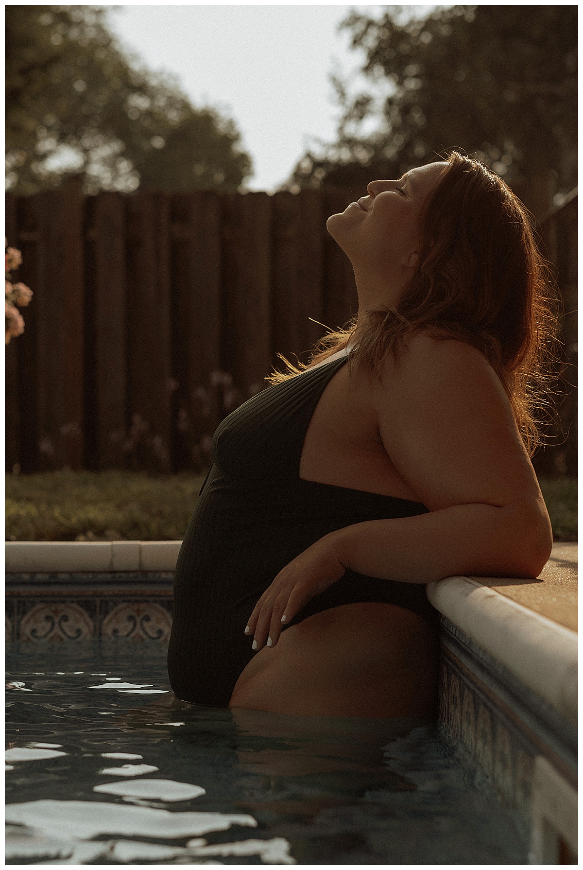 Adult leans against the edge of the pool by Mary Castillo Photography