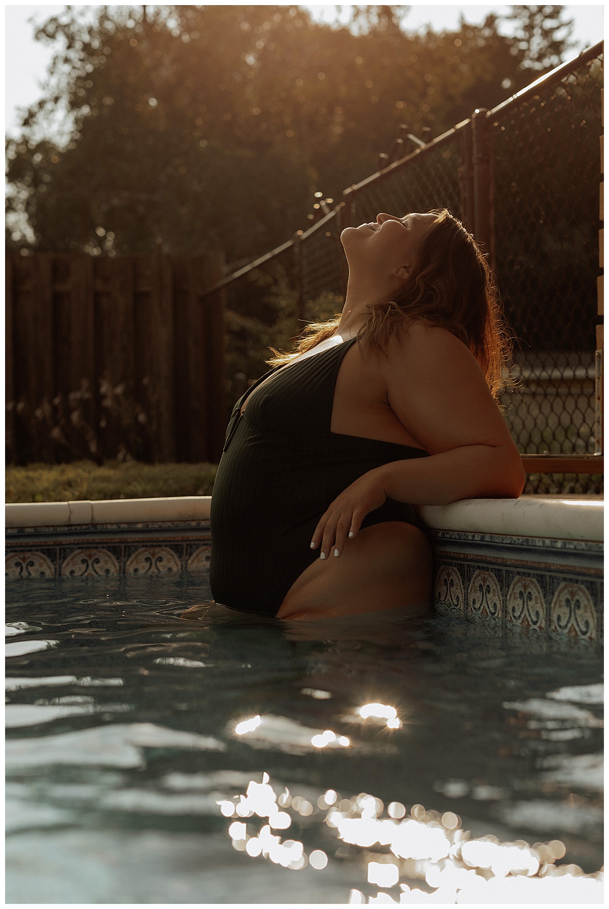 Woman wears black bathing siuit after following What to Wear for Your Pool Session 