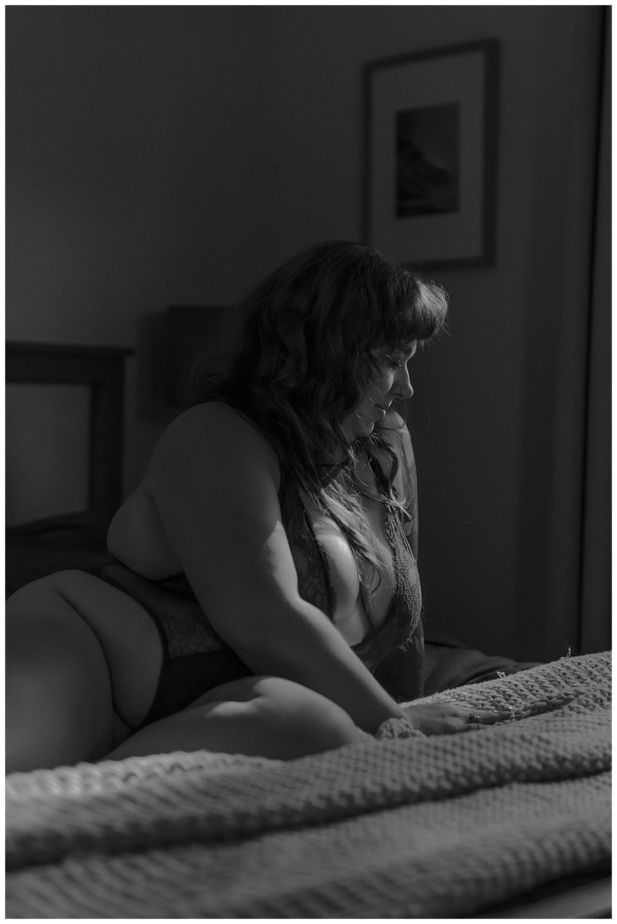 Woman sits on the bed for Minneapolis Boudoir Photographer