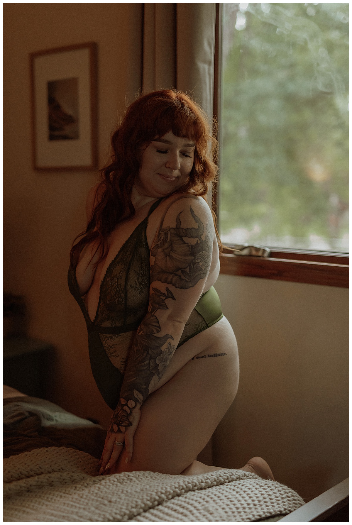 Female wears green lingerie set during this Moody Vibes boudoir home session 