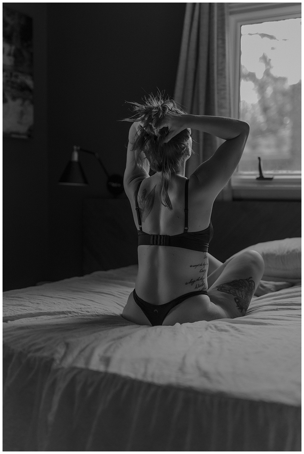 Adult holds her hair up Wearing a Cozy Outfits For a Boudoir Home Session