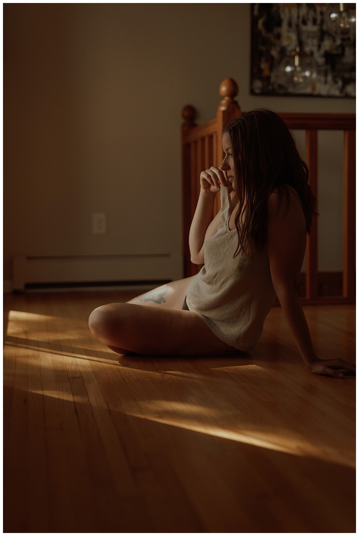 Woman sits on the floor wearing cozy lingerie for Mary Castillo Photography