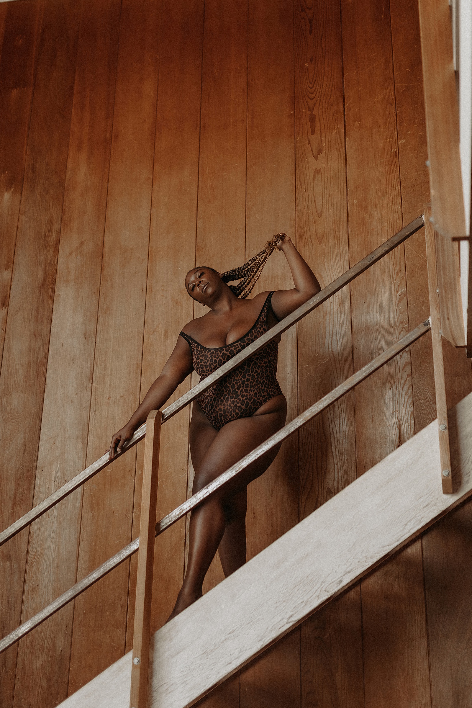 woman on staircase in bodysuit for creative session 