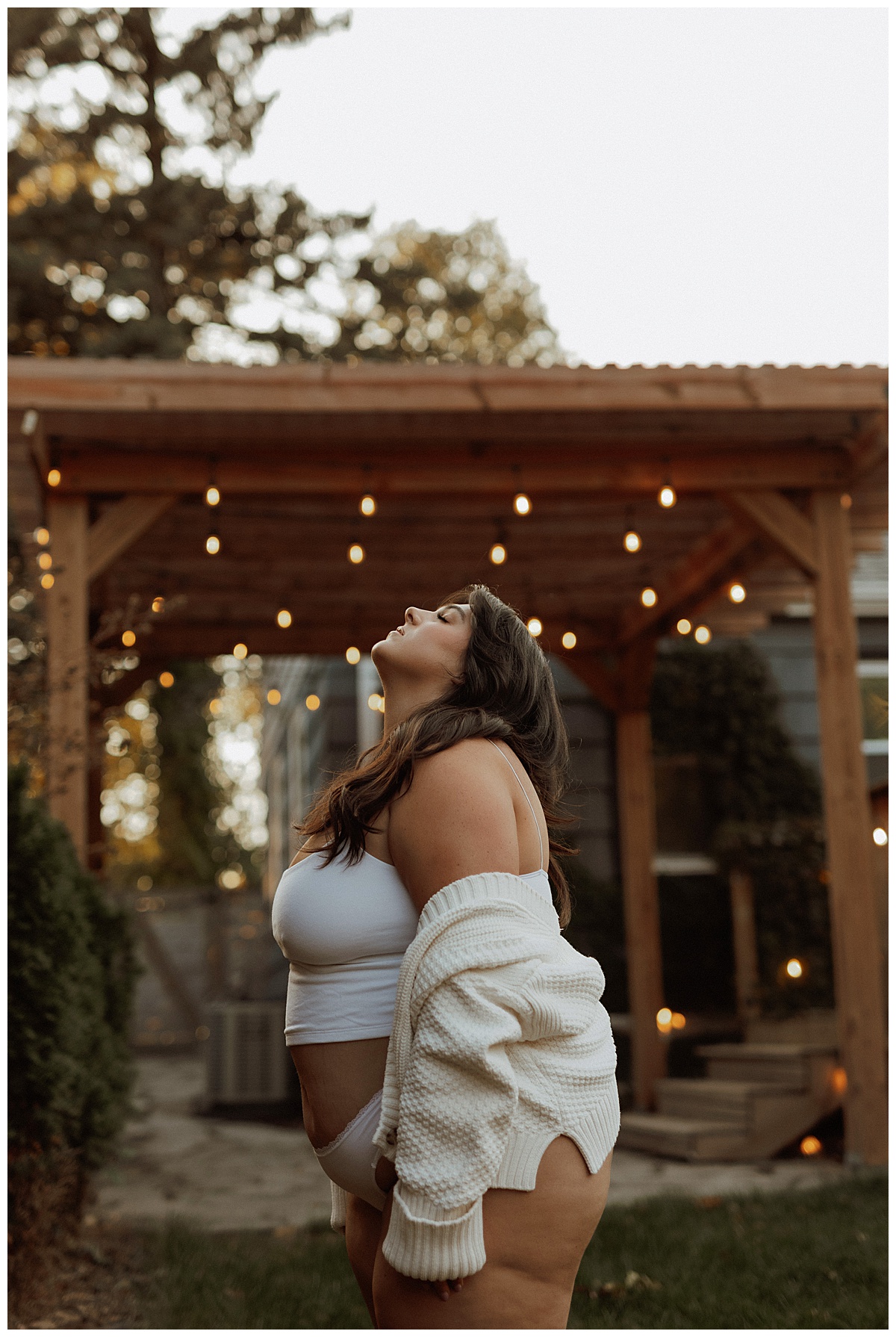 Adult looks up to the sky wearing lingerie for Minneapolis Boudoir Photographer