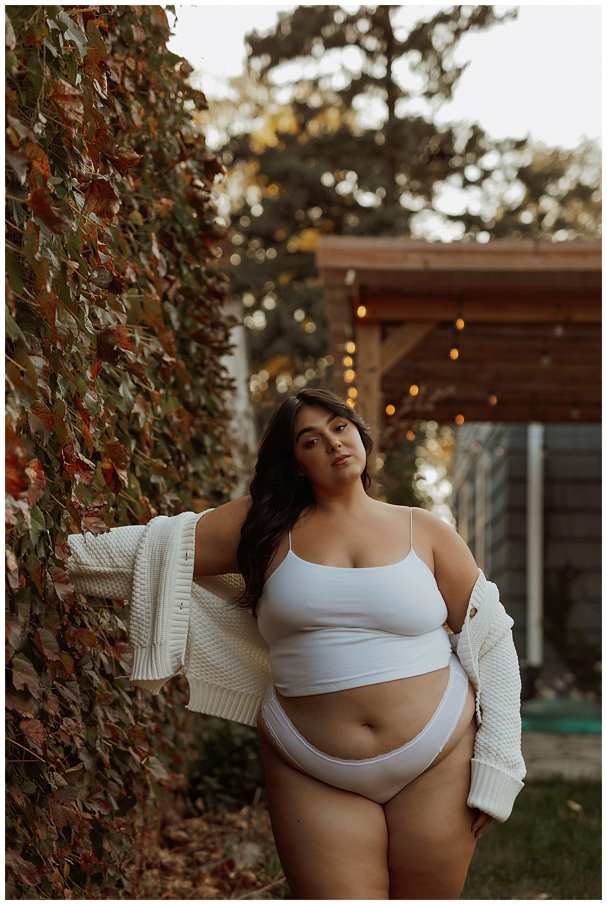 Person wears white matching set while modeling for Black Friday Sales for boudoir photographer