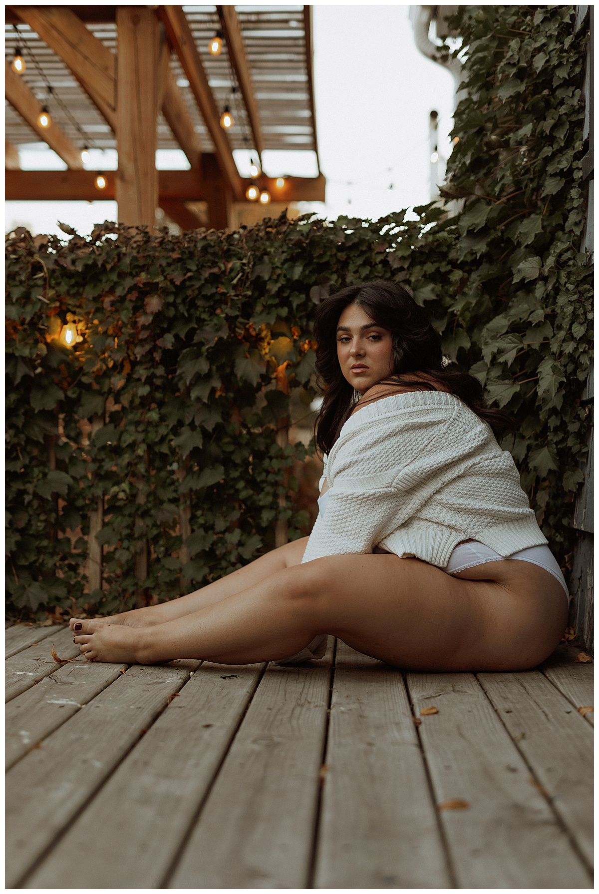 Person sits on the floor decking for Mary Castillo Photography