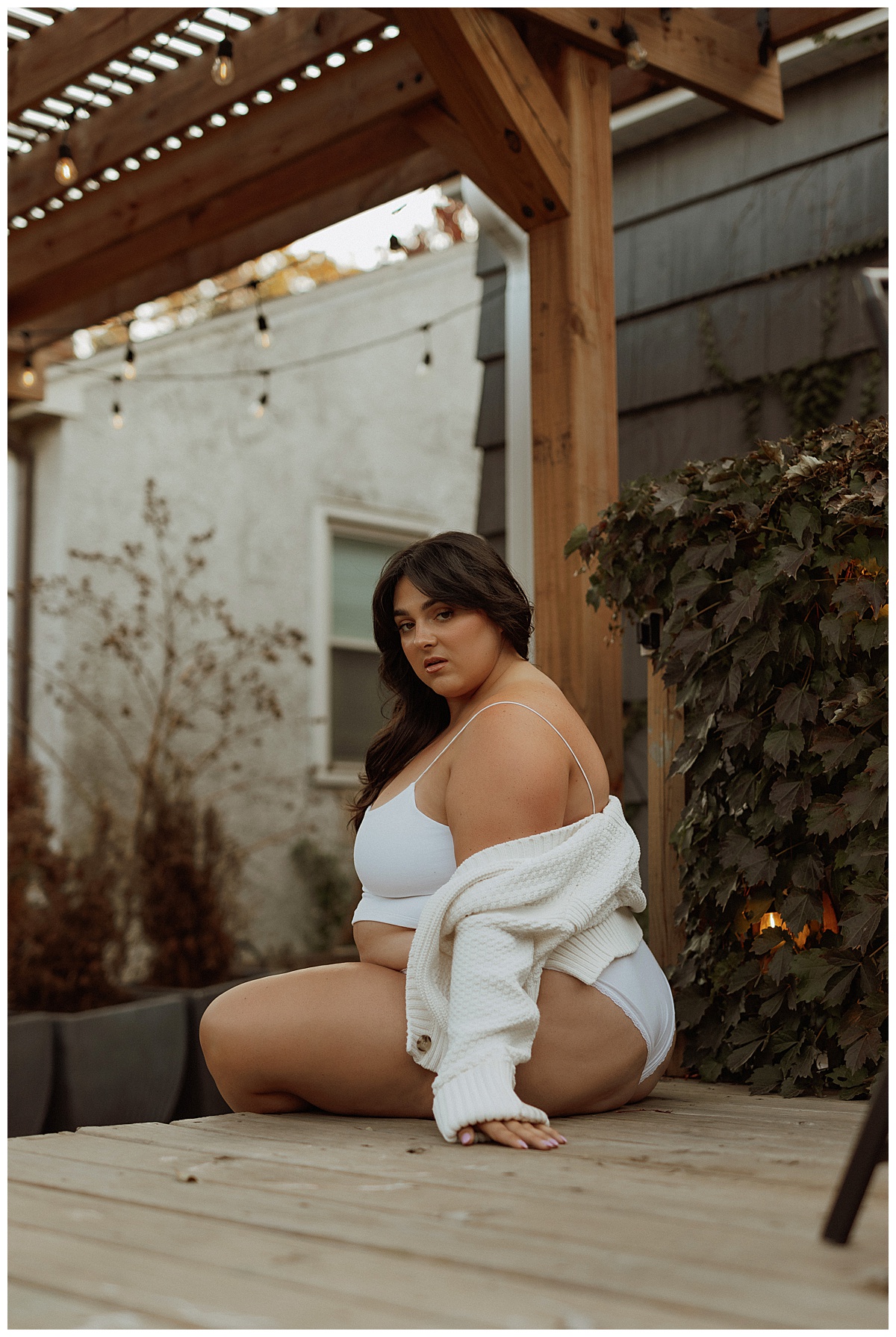 woman sits on the edge of the steps for Mary Castillo Photography