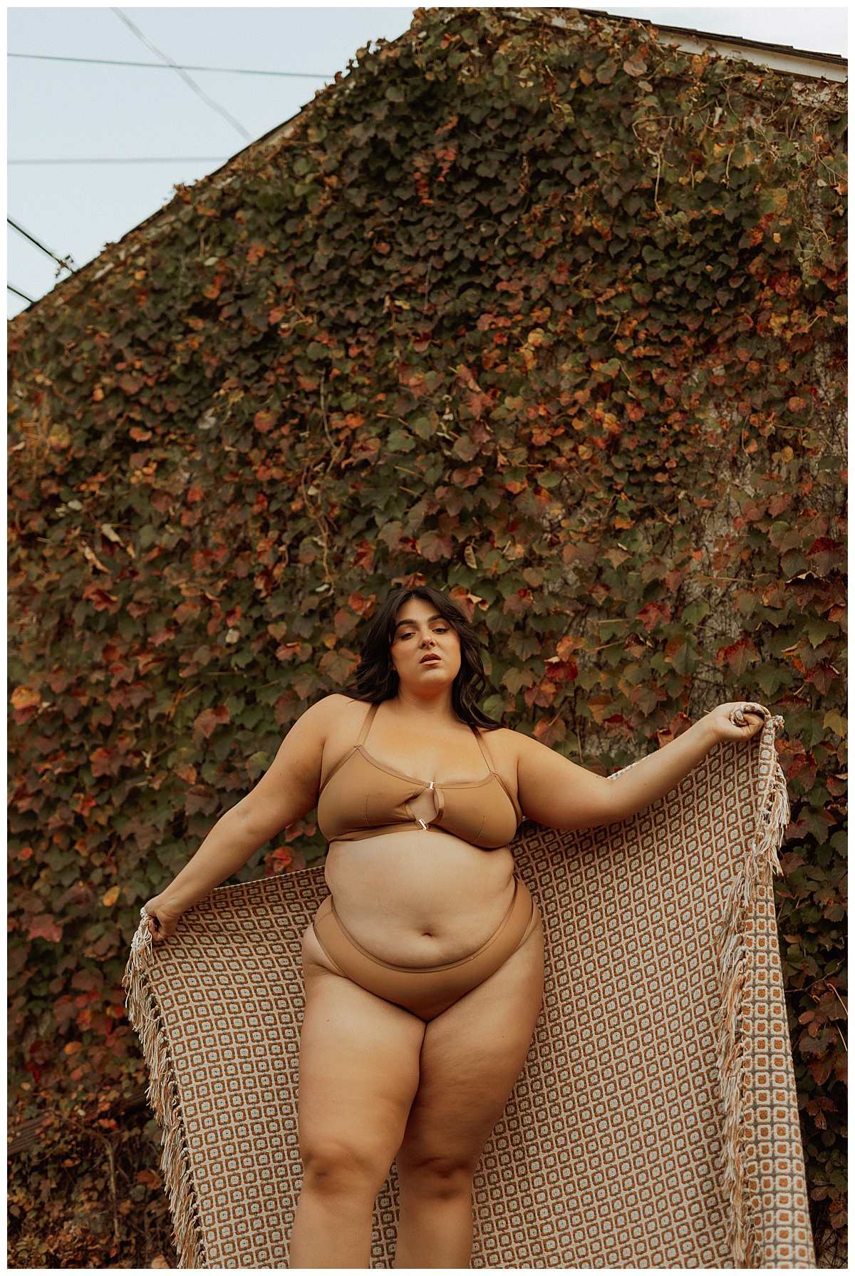 Person holds blanket around their body for Minneapolis Boudoir Photographer