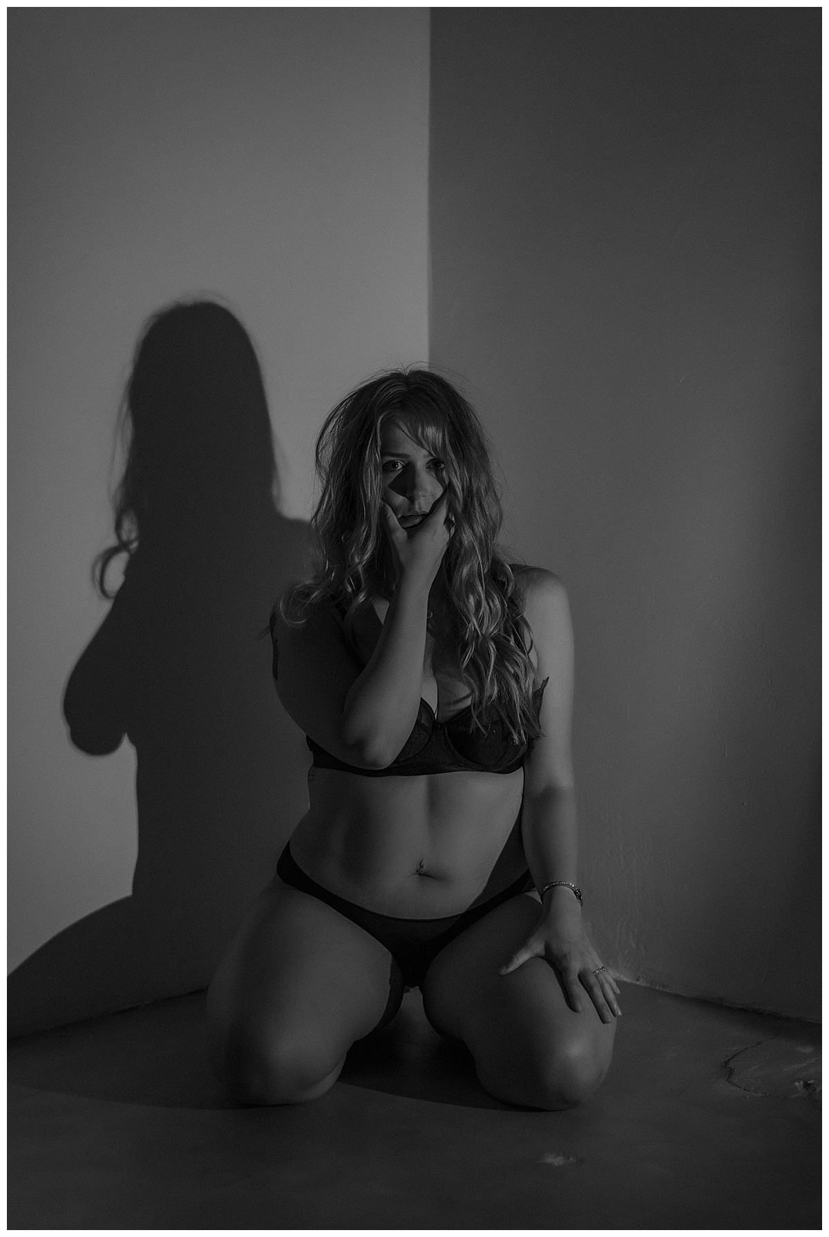 Person covers her mouth during this Spooky Vibes boudoir session